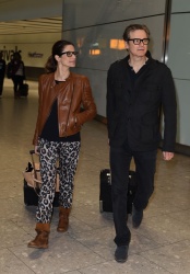 Colin Firth - is seen arriving at London’s Heathrow airport with his wife Livia (January 13, 2015) - 7xMQ QMxe2CxB
